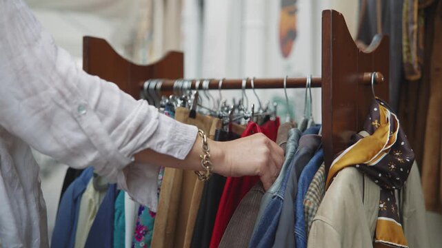 Female Hand Browsing Vintage Clothes at Palermo Street Market