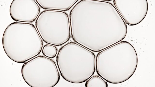 Bubble cluster transparent, cells under a microscope on white background. Gel texture with bubbles, skin care product. Macro Shot of Natural Organic Cosmetics, Medicine. High quality 4k footage