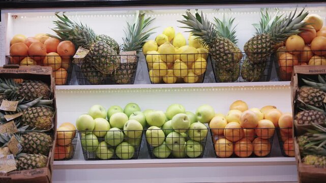 Vibrant Fresh Fruit Display in Modern Grocery Store Interior