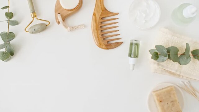 Spa treatment set. Essential oils, scrub, cream, massage roller. Organic Eucalyptus essence oil. Cosmetics based on natural ingredients. Spa the concept of skin care. High quality 4k footage