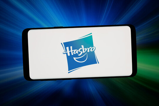 Stuttgart, Germany - 07-16-2026: In this photo illustration, the logo of US toy and entertainment company Hasbro Inc. is displayed on a smartphone in front of abstract background on computer screen.