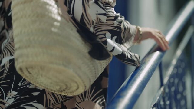 Stylish Woman Walking Stairs in Sidi Bou Said, Tunisia