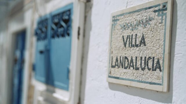 Villa Landalucia Sign on White Wall in Sidi Bou Said, Tunisia