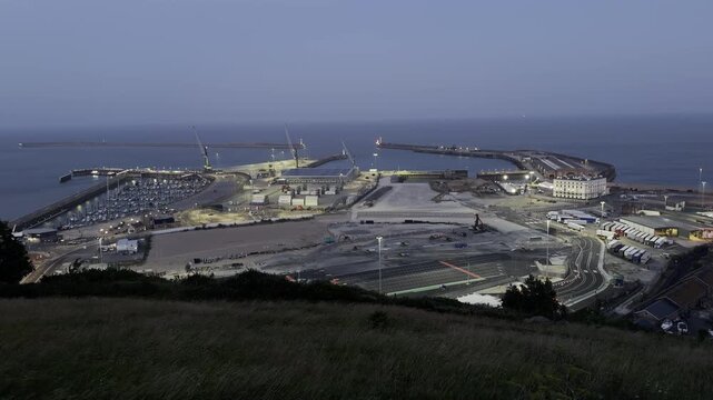 Wide coastal port infrastructure at dawn aerial