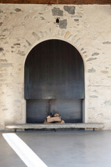 Obraz premium A close-up of an iron or steel fireplace, with pieces of wood inside.