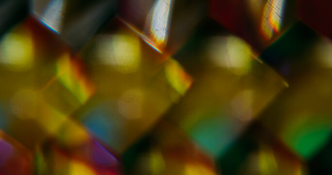 Cube glow. Blur geometric shape. Defocused yellow color shine lens flare glare flicker sparkle gleam on abstract light background.