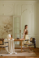 Elegant dining room interior with classic decor and a woman in motion, capturing a sophisticated ambiance and refined design © FollowTheFlow