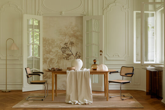 Elegant Living Space with Classic Design and Natural Light, Featuring a Wooden Table and Neutral Decor