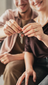 Happy couple holding the key to their new home