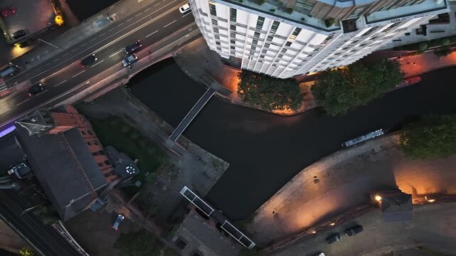 Top down aerial view of Deansgate Castlefield canal and junction at dusk Manchester Drone Bird view 