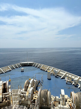 Bow of a cruise ship on the blue open sea