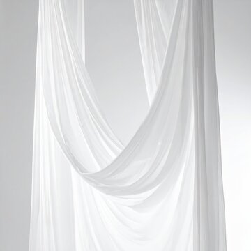 Soft white fabric drapes gracefully with elegant folds and curves