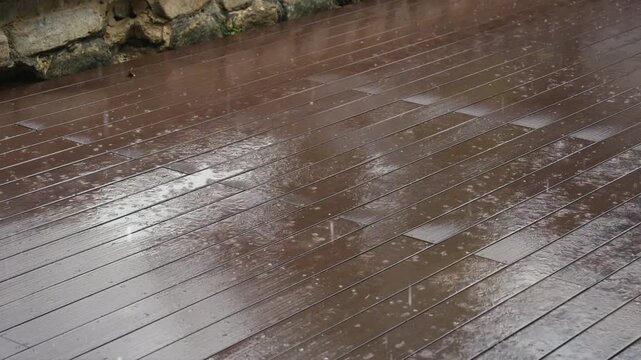 Rain Droplet Fall on Weathered Wood Deck Surface