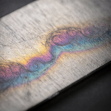 Iridescent Heat Tint Oxide Colors on Brushed Titanium Macro