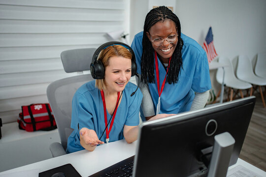 Two female nurses providing support and assistance in a medical call center