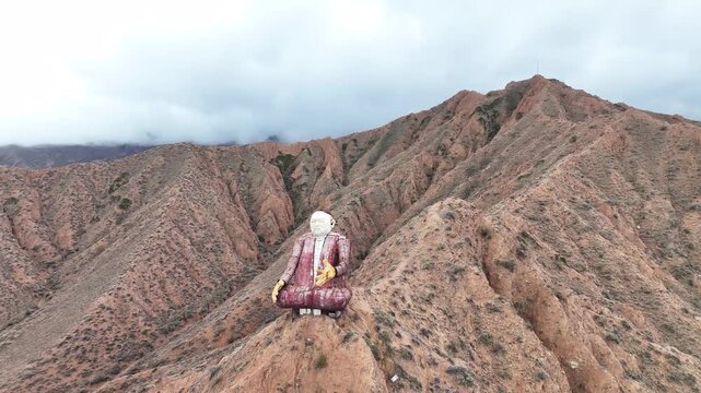 Sayakbai Karalaev Monument on rugged mountain ridge, Kyrgyzstan aerial