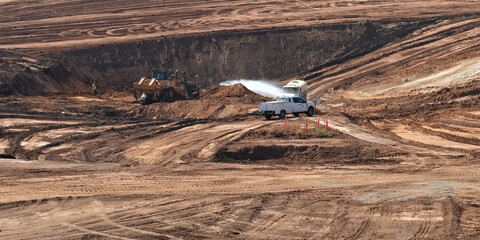 Water Truck Spraying Dust at a Yorba Linda Excavation Site © Savion