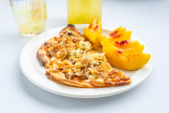 Breakfast on the table&mdash;pizza and juice.
