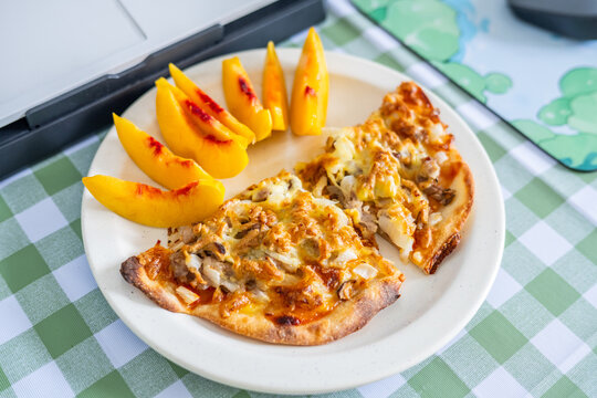 A working lunch at the desk&mdash;pizza and fruit juice.