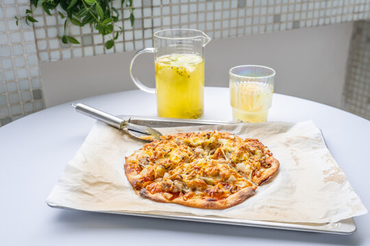 Pizza and juice on the dining table