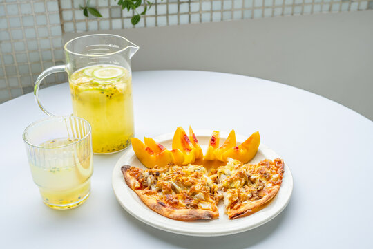 Breakfast on the table&mdash;pizza and juice.