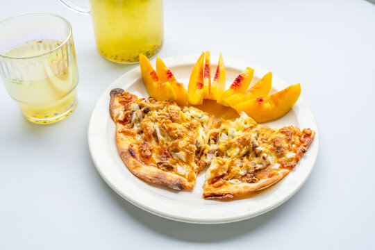 Breakfast on the table&mdash;pizza and juice.