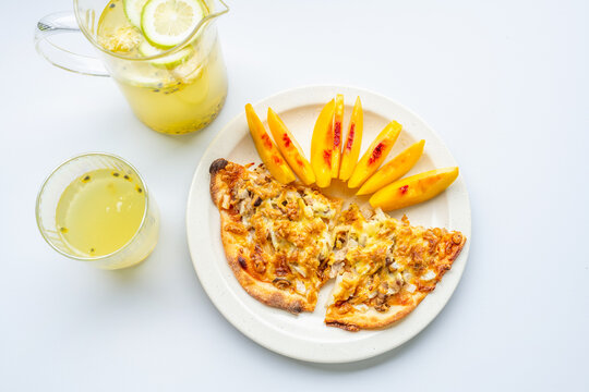 Breakfast on the table&mdash;pizza and juice.
