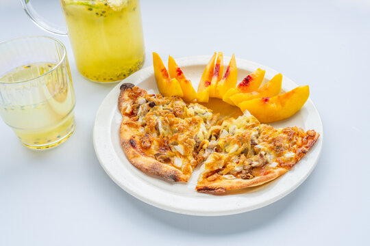 Breakfast on the table&mdash;pizza and juice.