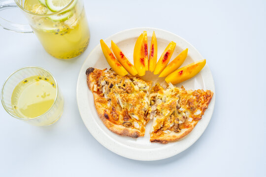 Breakfast on the table&mdash;pizza and juice.