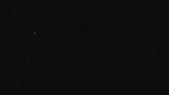 4K Old Film Overlay Effect with Noise, Dirt, Dust, Scratches, and Grain on Damaged Film. Vintage 8mm Film Look for Screen or Overlay Blending Mode.