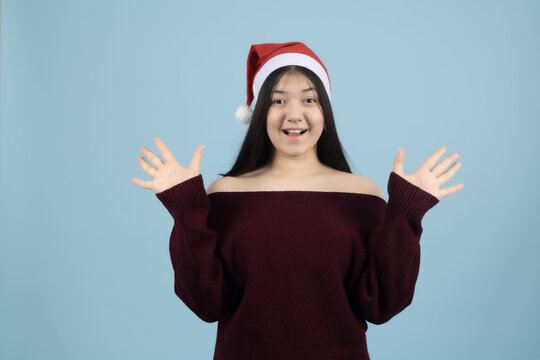 Emotional young woman spreading her hands apart explaining things actively