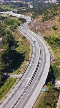 Aerial Drone Shot of a Traffic Flow on a curvy road at Daytime.
