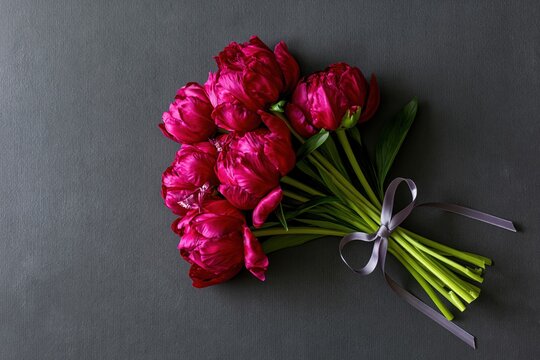 The Pink Tulip Bouquet Resting on a Dark Slate Background