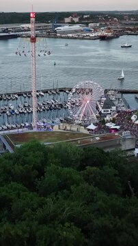 Aerial footage of famous Kieler Woche (Kiel Week) sailing and summer festival along the Kiellinie waterfront in Kiel, Germany. Funfair during famous Kieler Woche (Kiel Week).