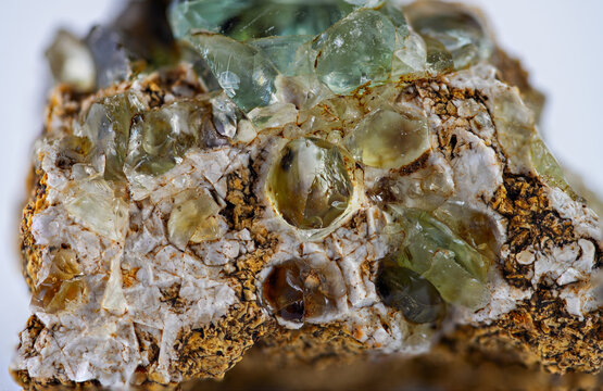 Mineral sample with green and brown crystals found in the Earth