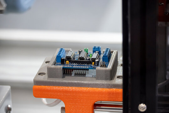 Close-up of 3D printing parts used as a custom assembly jig for the electronics parts manufacturing process.