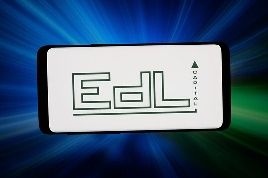 Stuttgart, Germany - 07-16-2026: In this photo illustration, the logo of Swiss investment company EDL Capital AG is displayed on a smartphone in front of abstract background on computer screen.