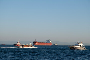 Fototapeta premium Busy Ship Traffic on the Bosphorus Strait. Maritime Traffic in the Bosphorus, Istanbul. Heavy Vessel Traffic on the Bosphorus Waterway.