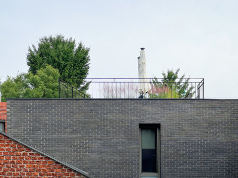 TypicaI residential house exterior in urban South Korea, showing everyday urban living environment.