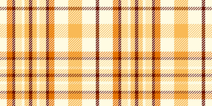 A seamless geometric tartan in a light honey-caramel colorway, classic tweed throw, and fabric texture make for cozy fall decor.