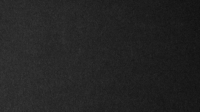 Black paper background overlay dust and scratch moving. paper texture stop motion animation. video effect for video editing. dusty grunge rough vintage video for background. texture animated bg.