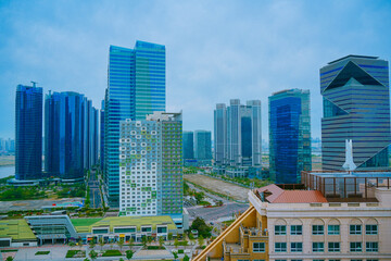 Naklejka premium Songdo, Incheon, South Korea; 05 04 2025: The beautiful landscape of Songdo island International Business District (Songdo IBD) in South Korea. It is connected to Incheon airport