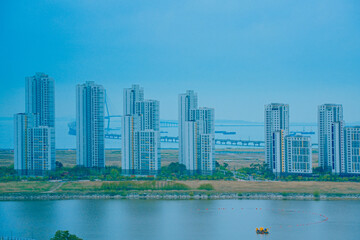 Fototapeta premium Songdo, Incheon, South Korea; 05 04 2025: The beautiful landscape of Songdo island International Business District (Songdo IBD) in South Korea. It is connected to Incheon airport