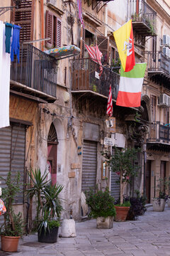 Palermo, Italy; January 1st 2026: City balconies displaying the flags of the city and Sicily.