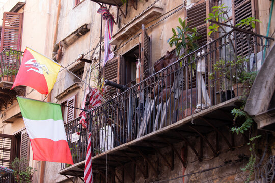 Palermo, Italy; January 1st 2026: City balconies displaying the flags of the city and Sicily.