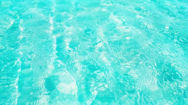 close-up of turquoise fresh water texture, high angle view of flowing water surface with sunlight reflections for beauty and body care, spa or travel destinations