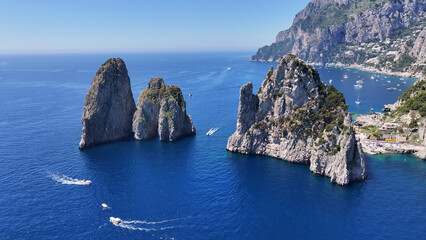 Naklejka premium Faraglioni Of Capri In Naples Campania Italy. Bird Eye View Of A Amazing Coastal Beach In The Summer Holiday. Coast Horizon Seaside Summertime. Coast Panoramic. Naples Campania.