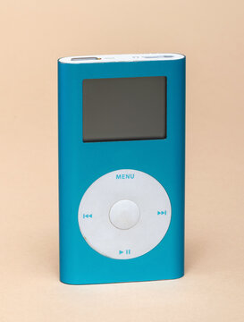 Apple iPod mini, a classic portable digital music player, standing on a light background