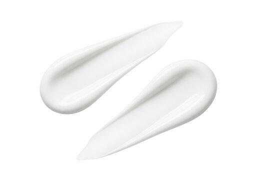 Two smears of white cosmetic cream or face lotion isolated on a white background