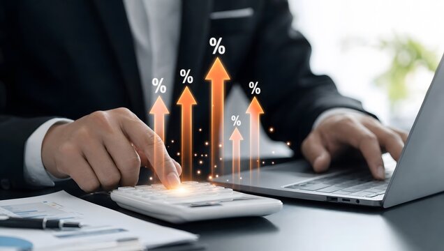 Businessman calculate interest and financial growth with calculator and laptop, concept of business and finance.